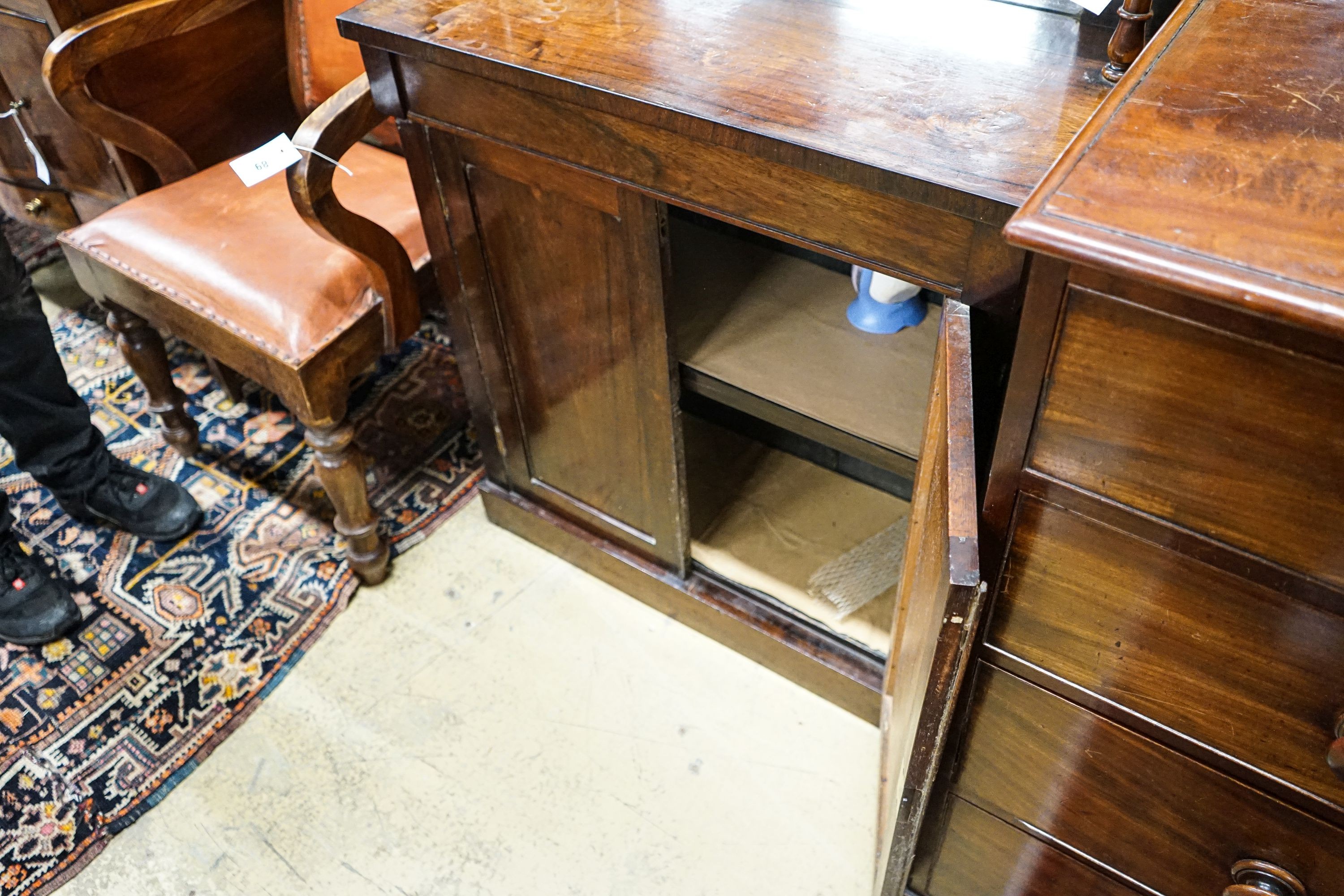 A small Victorian rosewood chiffonier with raised mirror back, 3/4 gallery over a pair of plain panelled doors on plinth base, width 77cm, depth 34cm, height 112cm